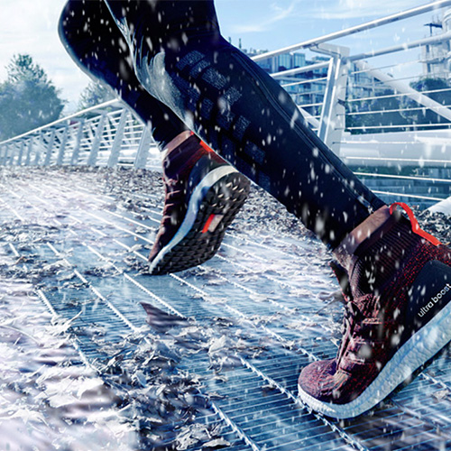 Running Speed. Running on bridge with Acisis size 9 running trainers in the snow at winter time